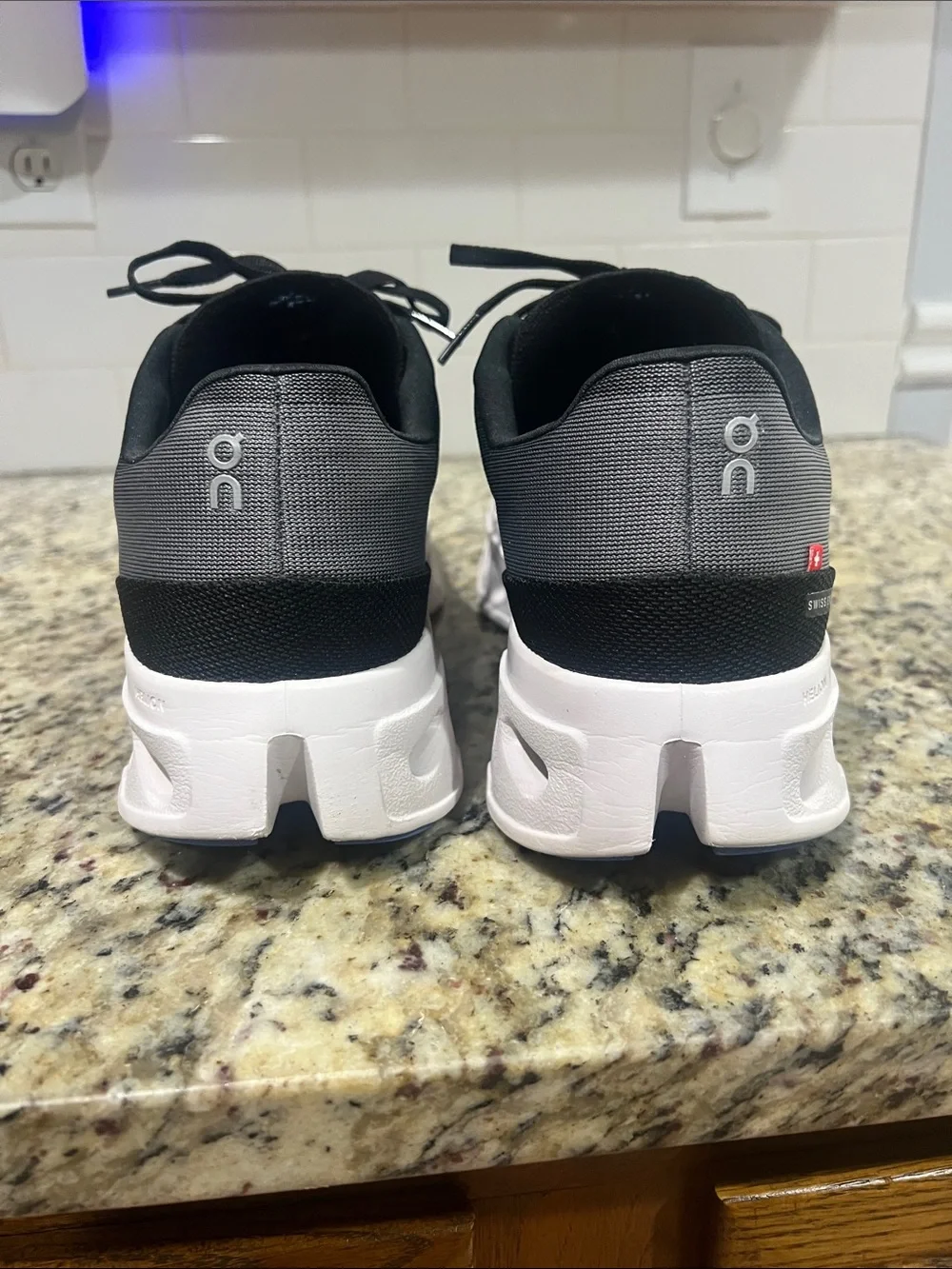 On Running Men's/Women's Trainer in Black and Gray with White Sole